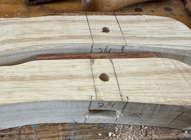 Holes have been drilled in the sides of the handles