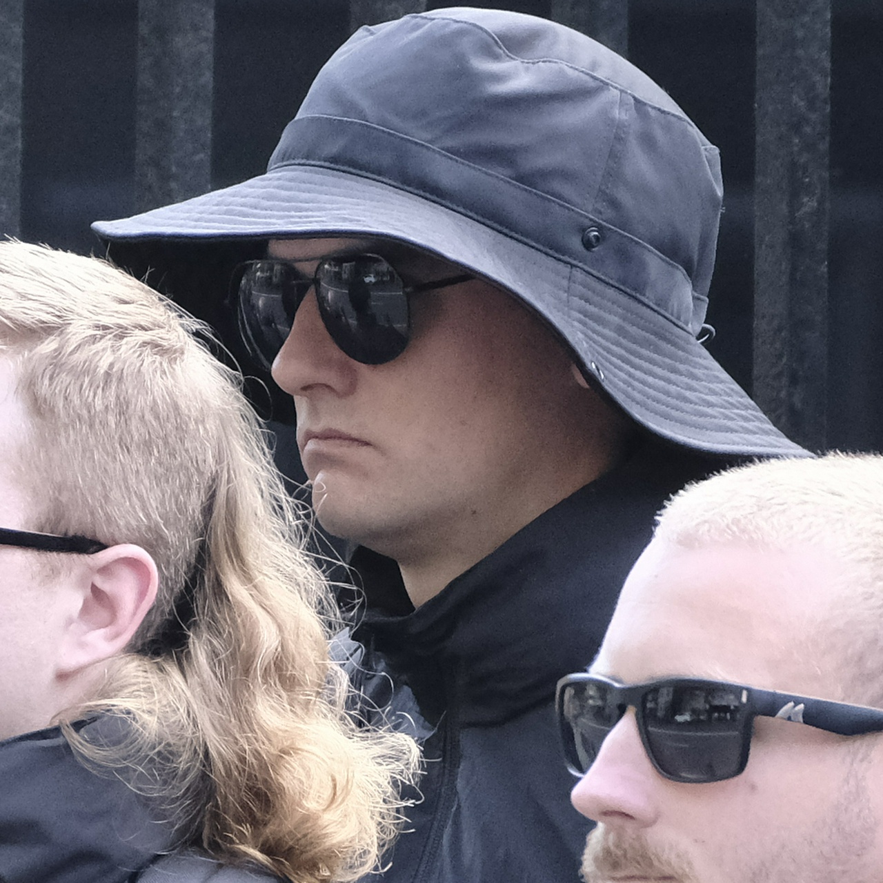 The same man from the other side, showing his darkish eyebrows and part of his eye
