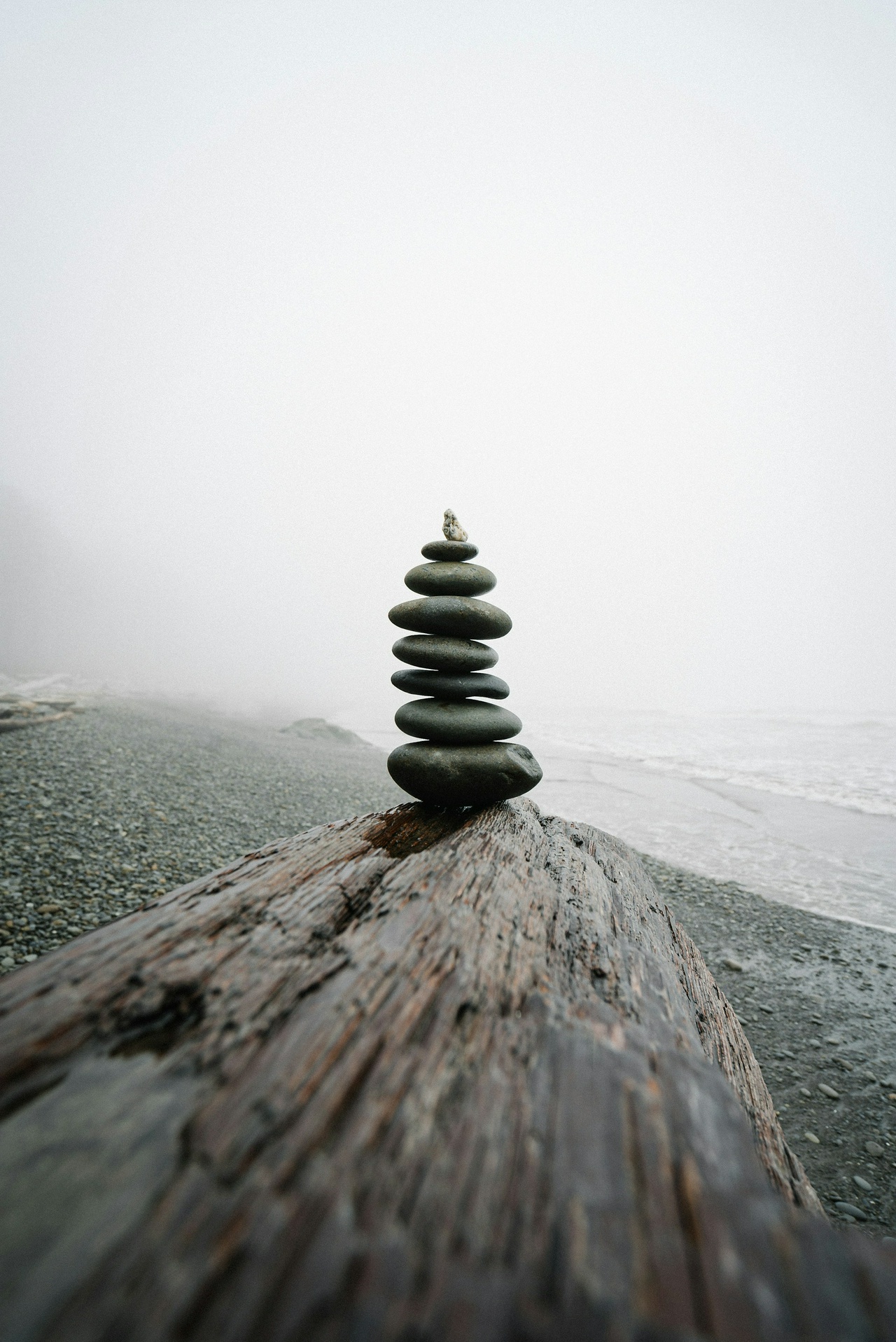 stack of stones on a foggy weather, Ruby Beach, WA, by Karsten Winegeart