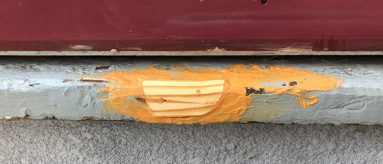 Patch on the threshold of the rear door of my house in Minneapolis, post-repair