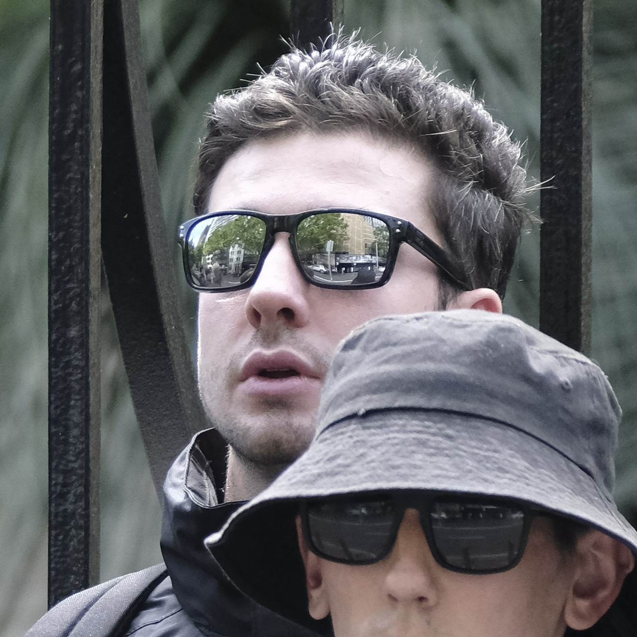 The same man from a side angle with his mouth agape