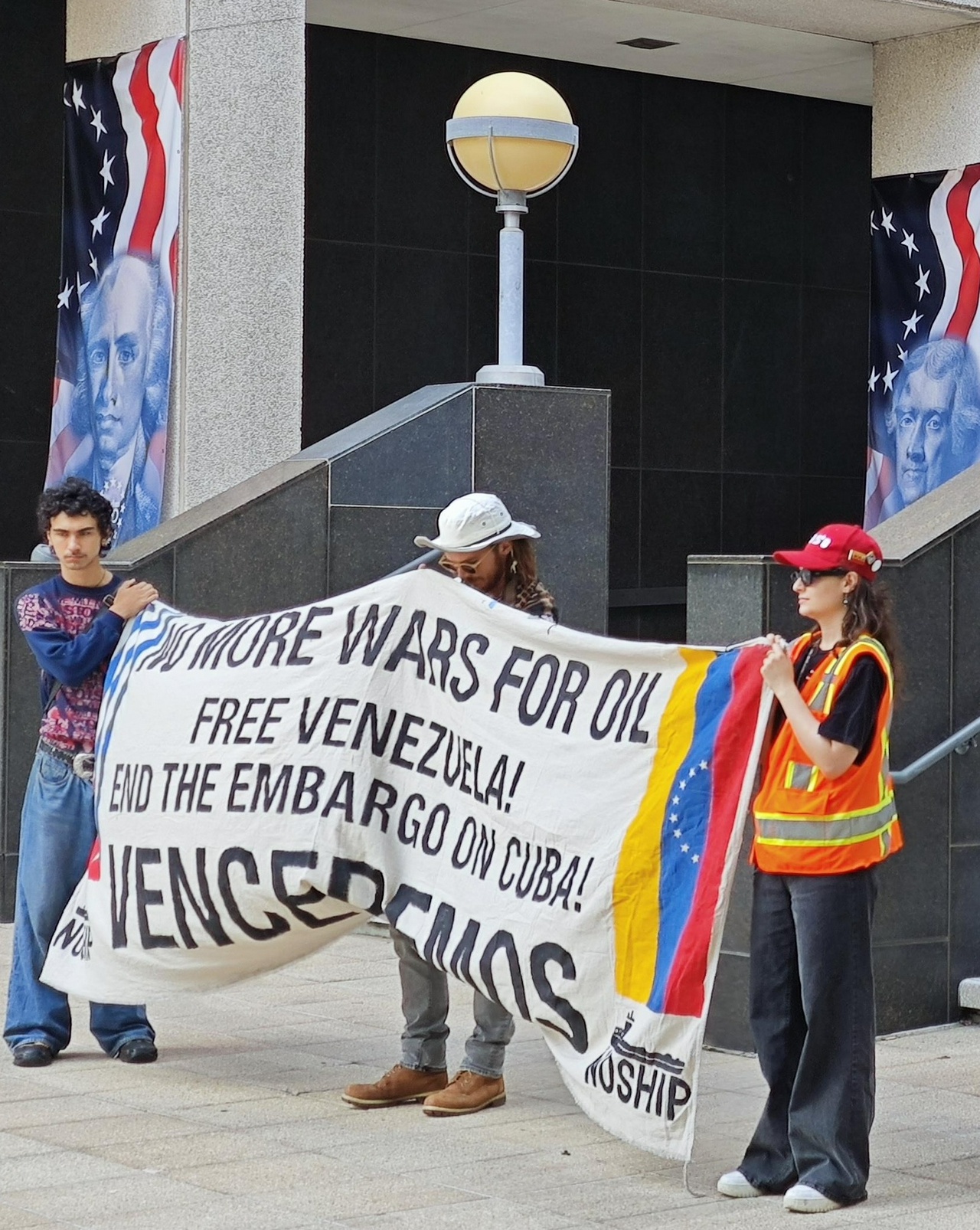 Members of New Orleans Stop Helping Israel's Ports hold a banner on the steps of the federal building. | Fight Back! News Members of New Orleans Stop Helping Israel's Ports hold a banner on the steps of the federal building.