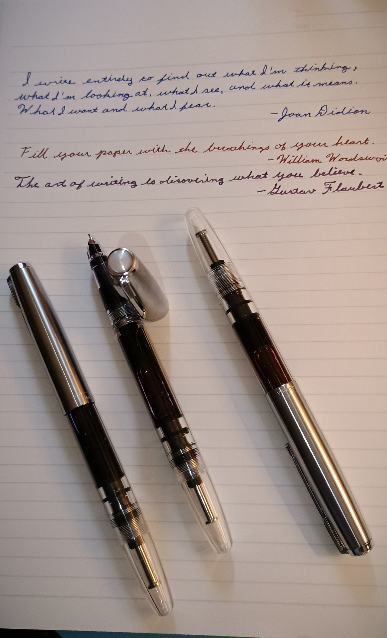 Three Wingsung 601 Demonstrator fountain pens, with writing sample.