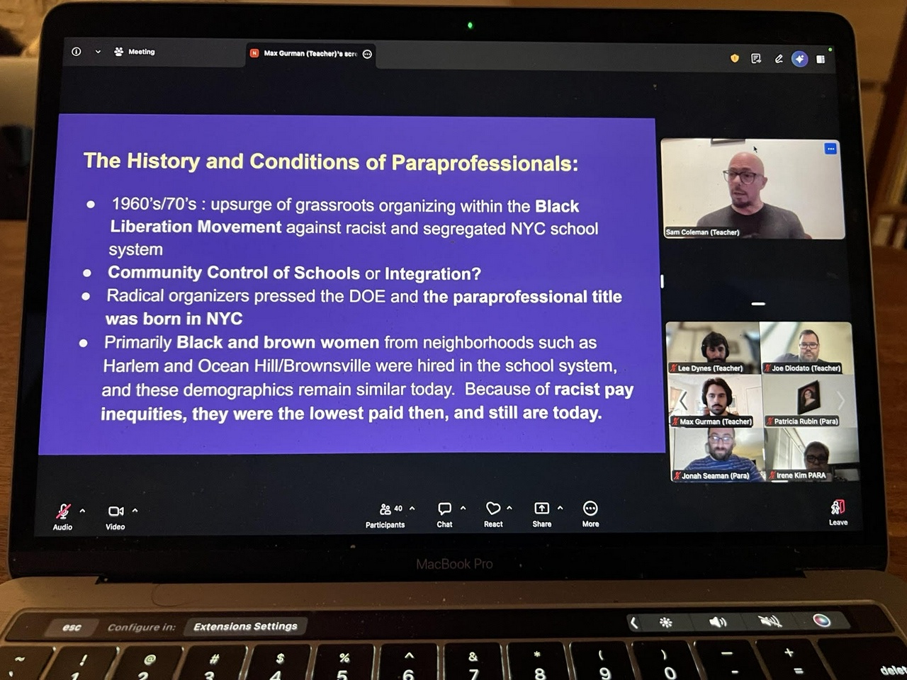 Laptop screen with a presentation on The History and Conditions of Paraprofessionals being shown