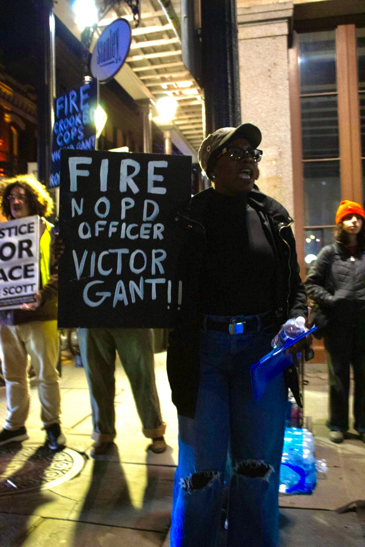 Shanta Scott, mother of Jace Lee Scott, holds a sign demanding the firing of corrupt NOPD Officer Victor Gant. | Fight Back! News Shanta Scott, mother of Jace Lee Scott, holds a sign demanding the firing of corrupt NOPD Officer Victor Gant.