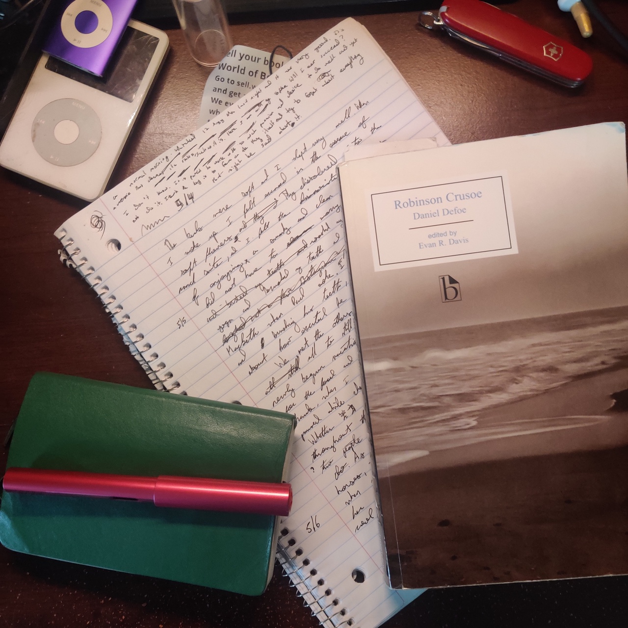 My desk with Robinson Crusoe and some handwritten drafts on it