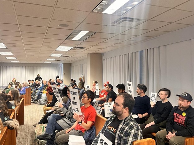 Immigrant rights advocates at the Minneapolis sanctuary ordinance public hearing.