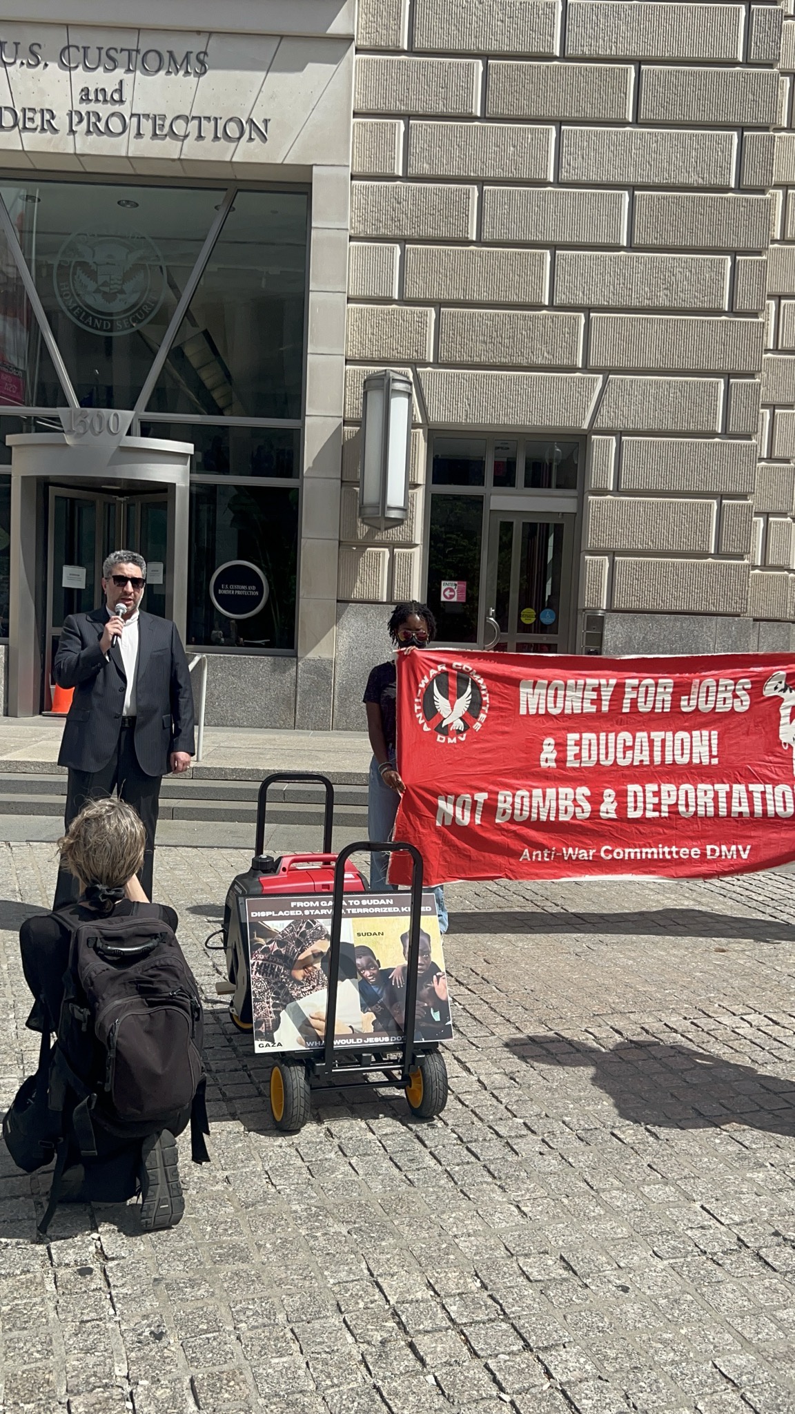 Tohid, Yousof Azizi's brother, speaks about his family's situation at the protest outside the CBP headquarters in DC.