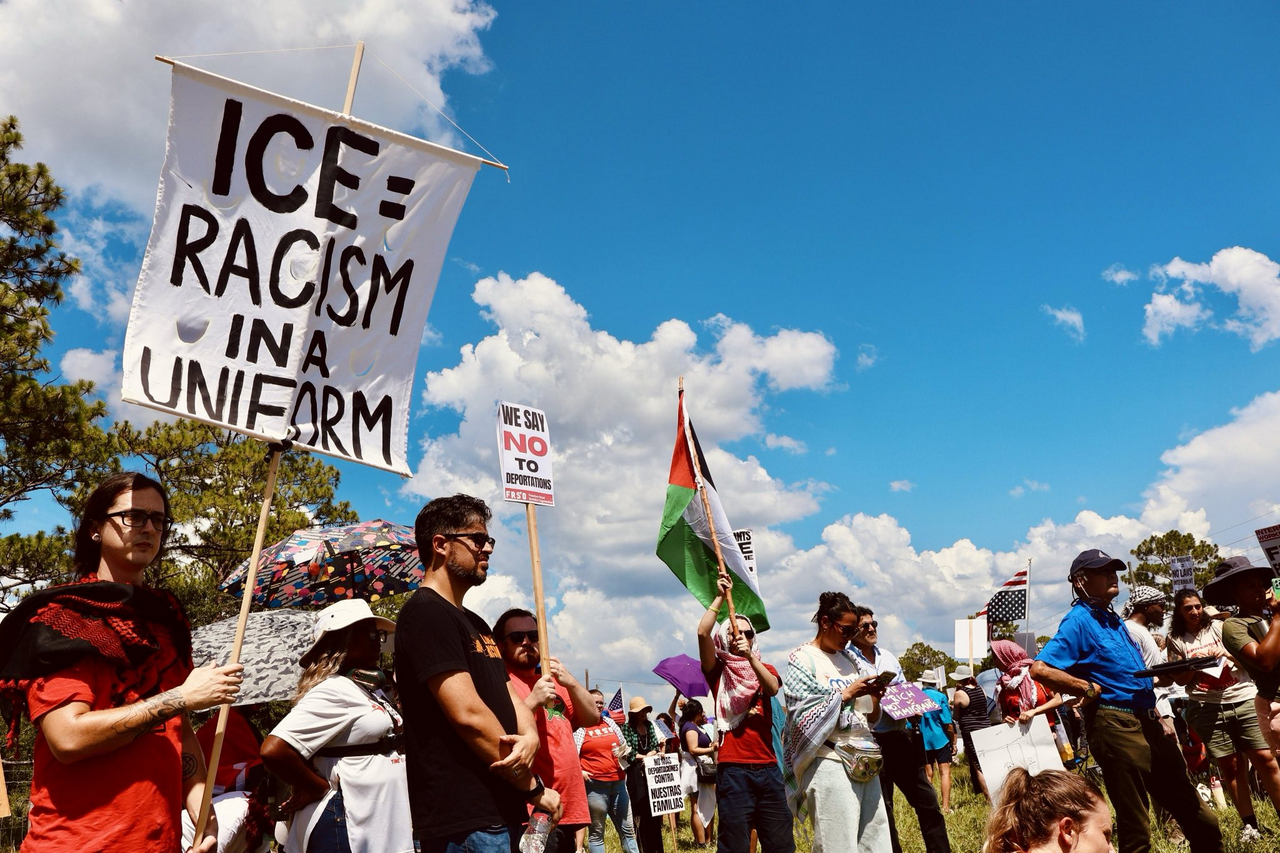A group of protesters holding signs.