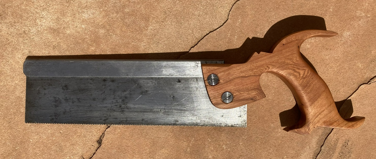 Finished dovetail saw with cherry handle, left side