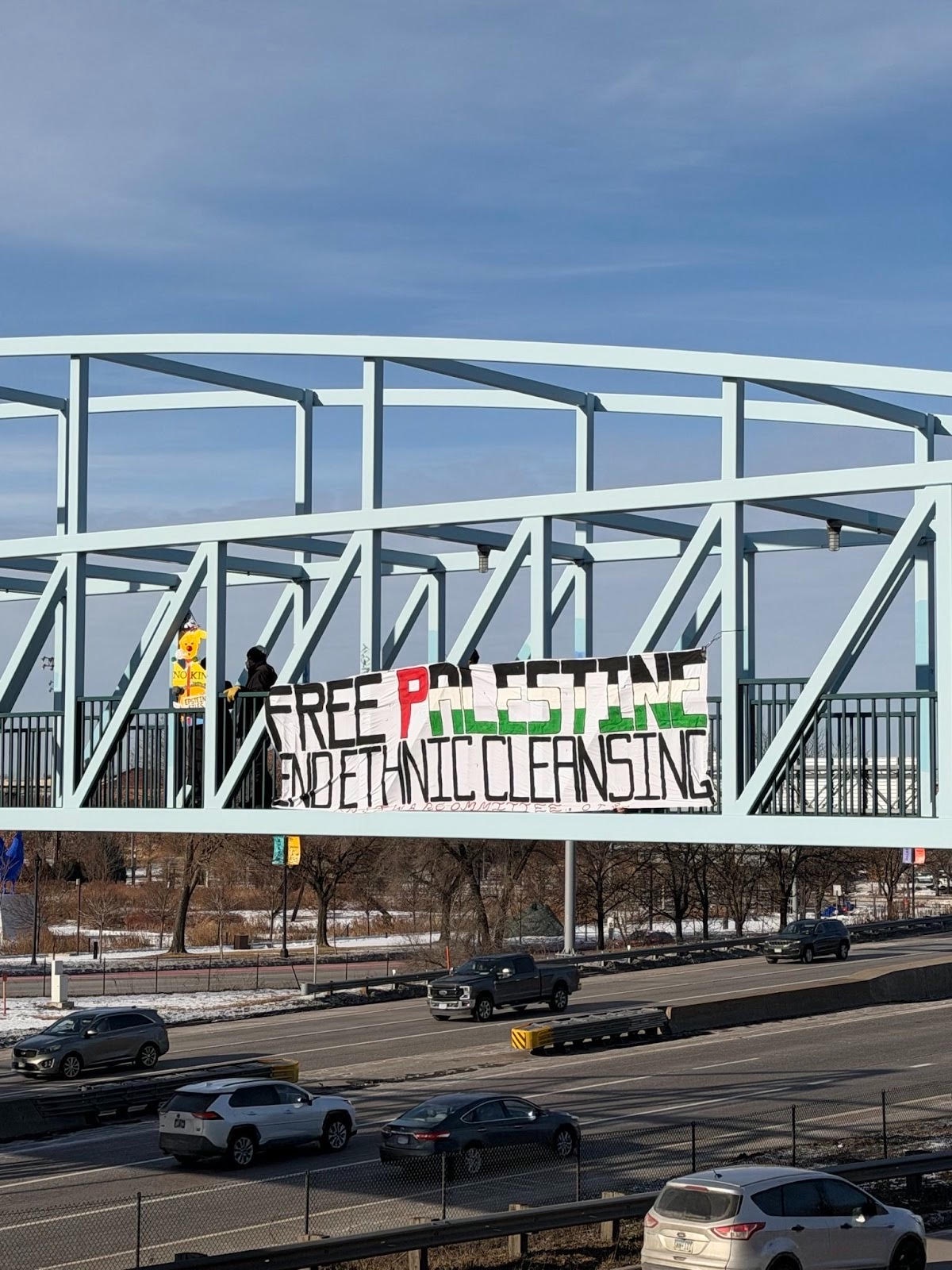 Minneapolis banner-drop demands a free Palestine.