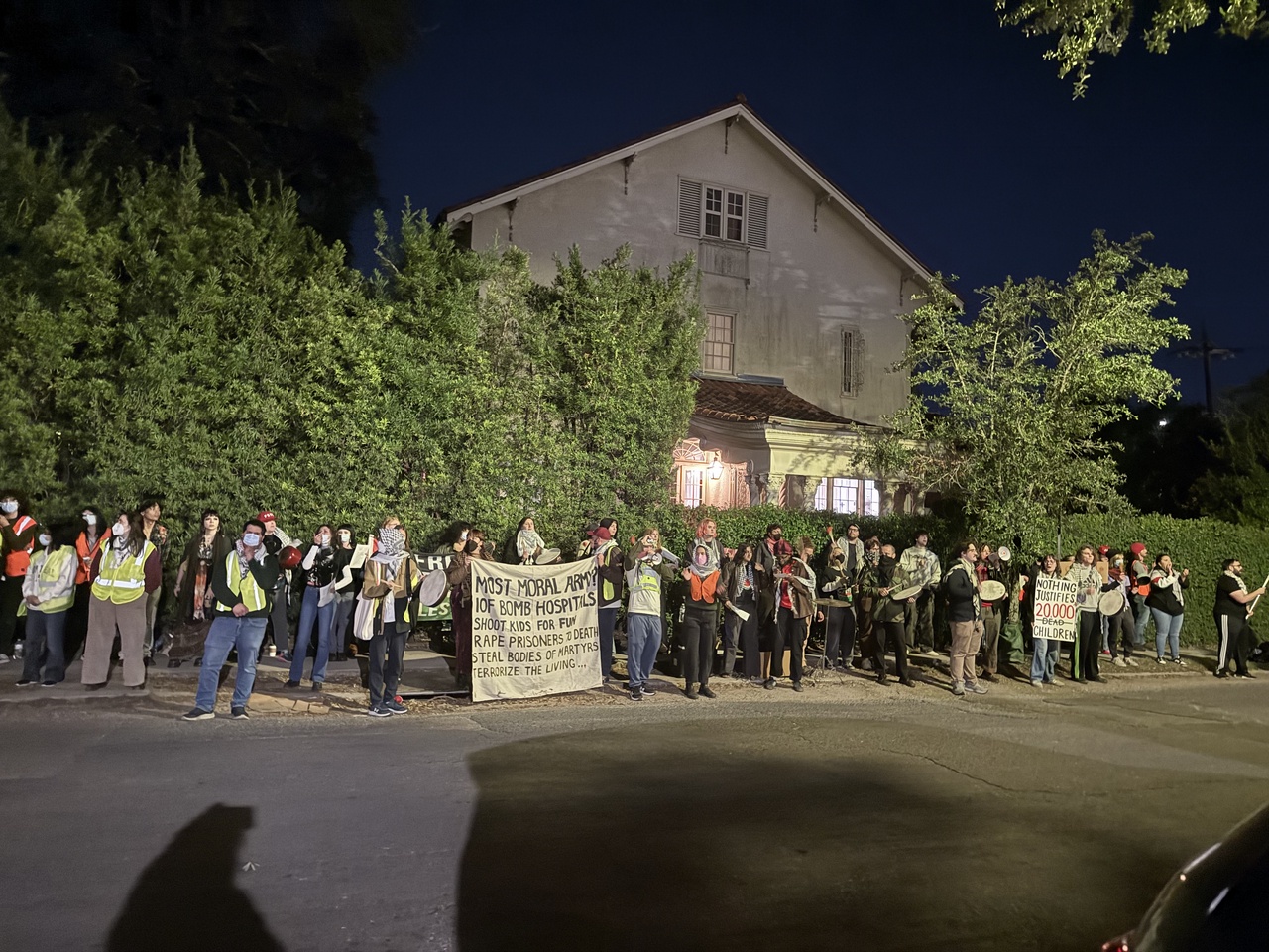 Protesters gather across the street from an IDF event near Tulane's campus for a noise demonstration.