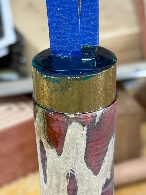 Knife blade inserted through the ferrule, with epoxy poured to secure everything in place