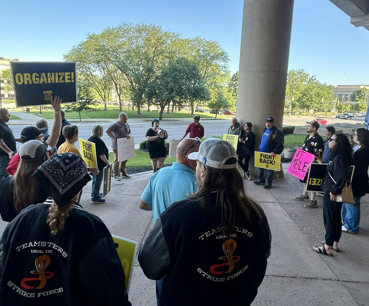 Horseshoe casino dealer speaks to crowd outside of NLRB Region 25 office.
