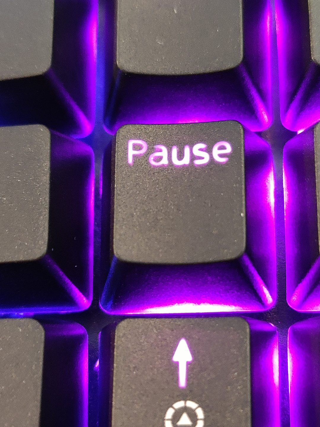 Image: key caps showing uneven shine-through lighting.