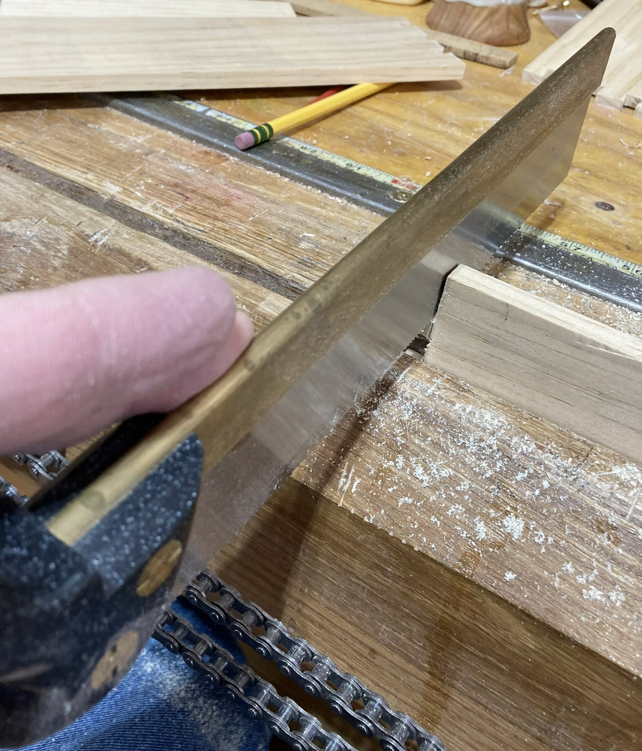 Remove the waste from outside the pins using a back saw