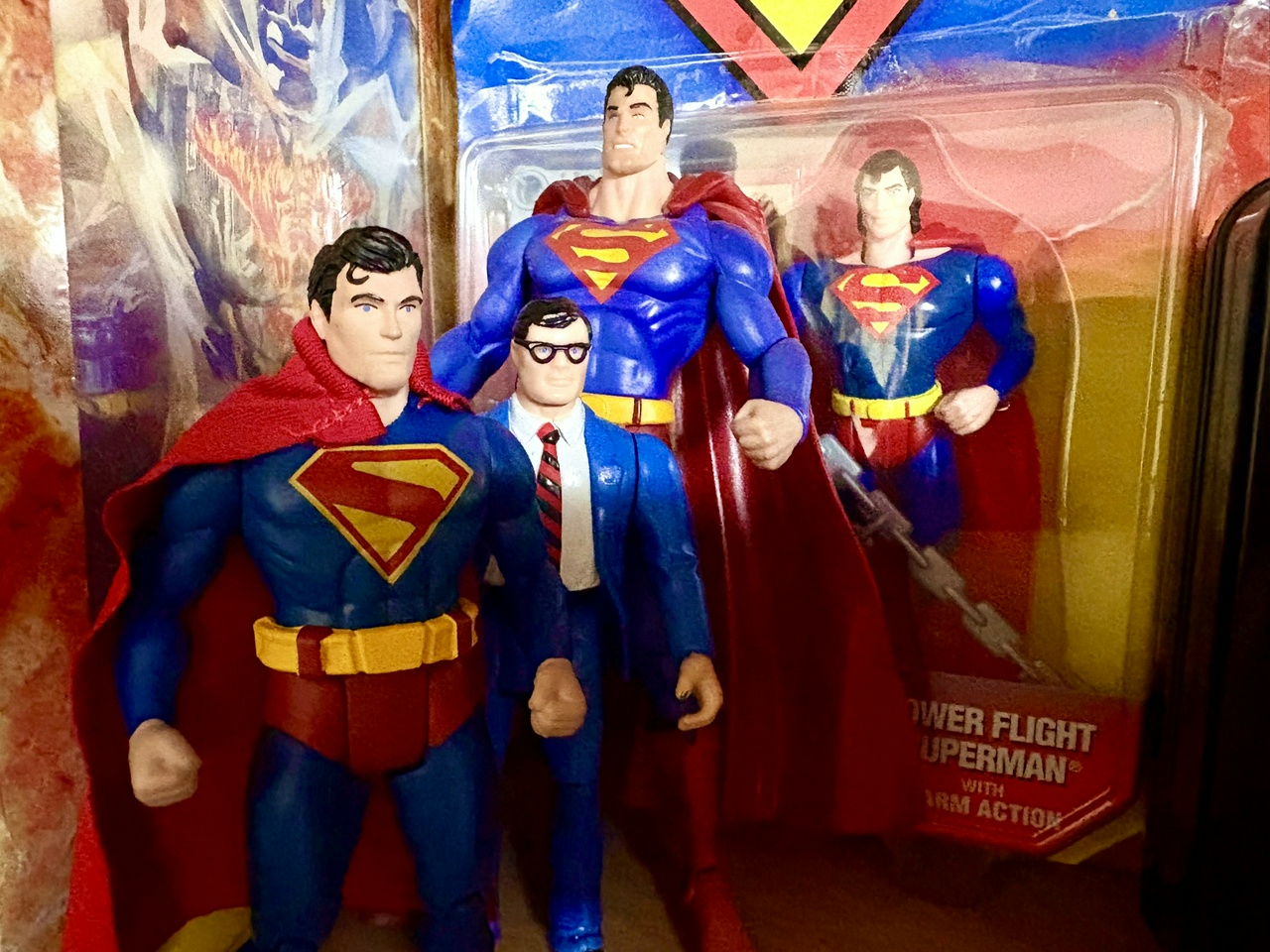 A collection of Superman figures in their blue and red glory