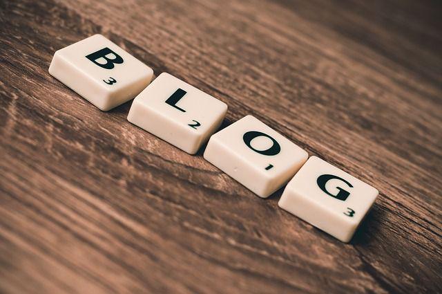 Scrabble tiles laid out to spell 'BLOG'