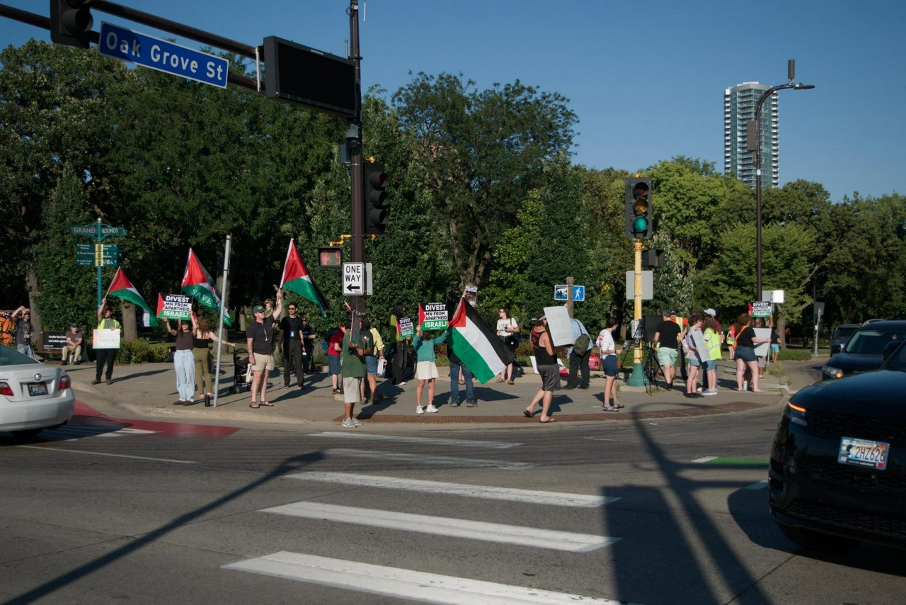 Minnesota protesters call to end State investments in Palantir, end U.S. aid to Israel. | Photo Credit: Sam Ball