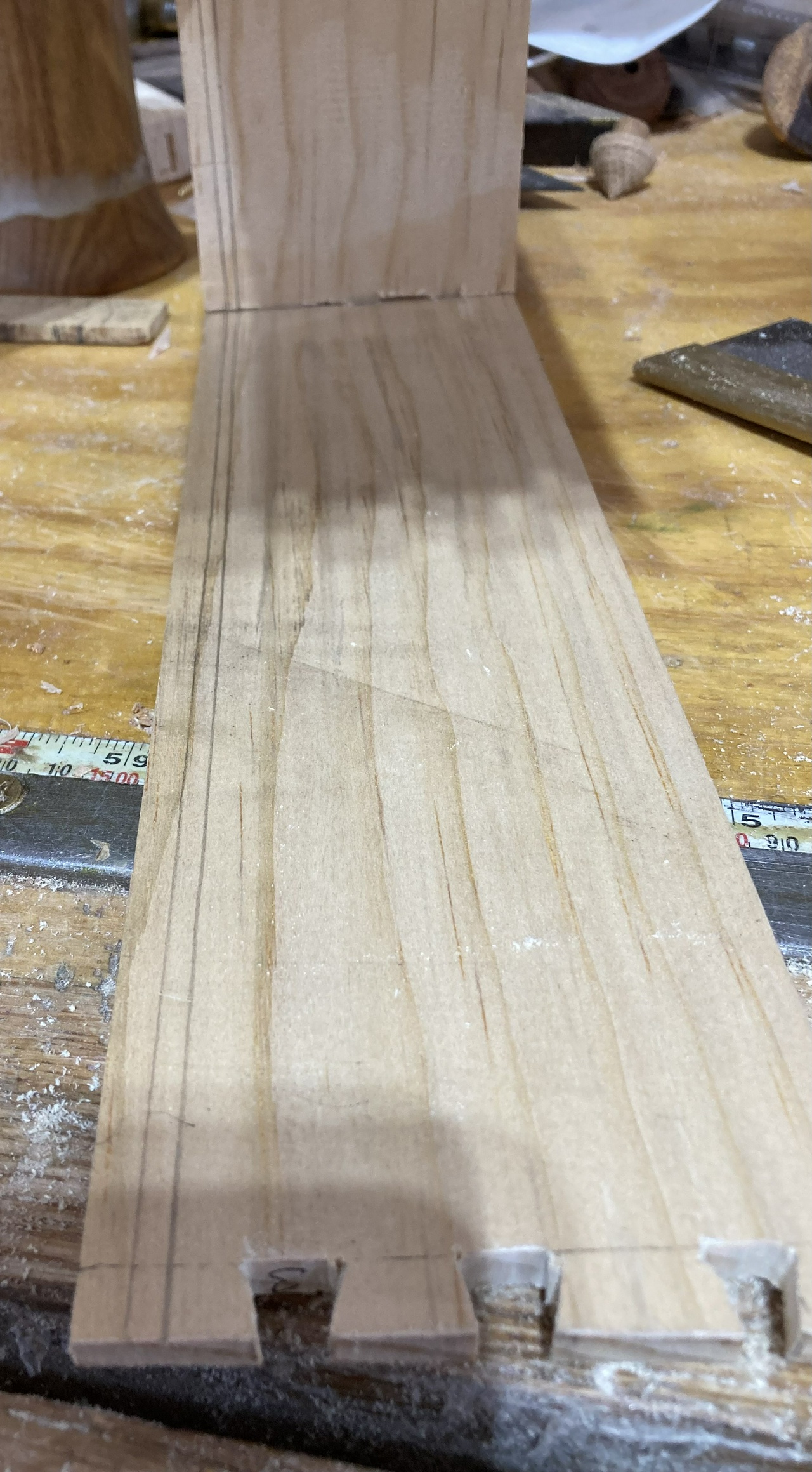 Marking the grooves where the bottom of the drawer will fit