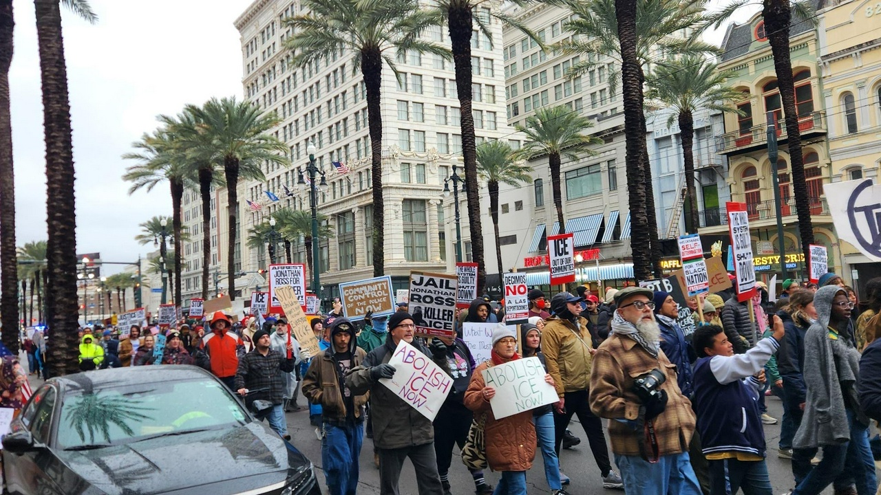 Protesters march down the busy Canal Street in downtown New Orleans.
