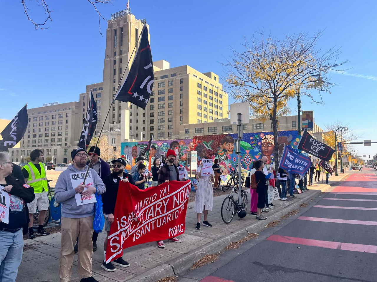 Protest to stop ICE and police terror in Minneapolis. | Fight Back! News A group of protesters standing on a sidewalk.