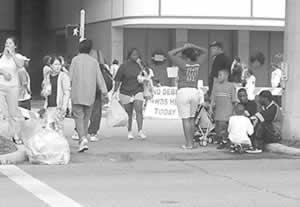 Evacuees dragging belongings