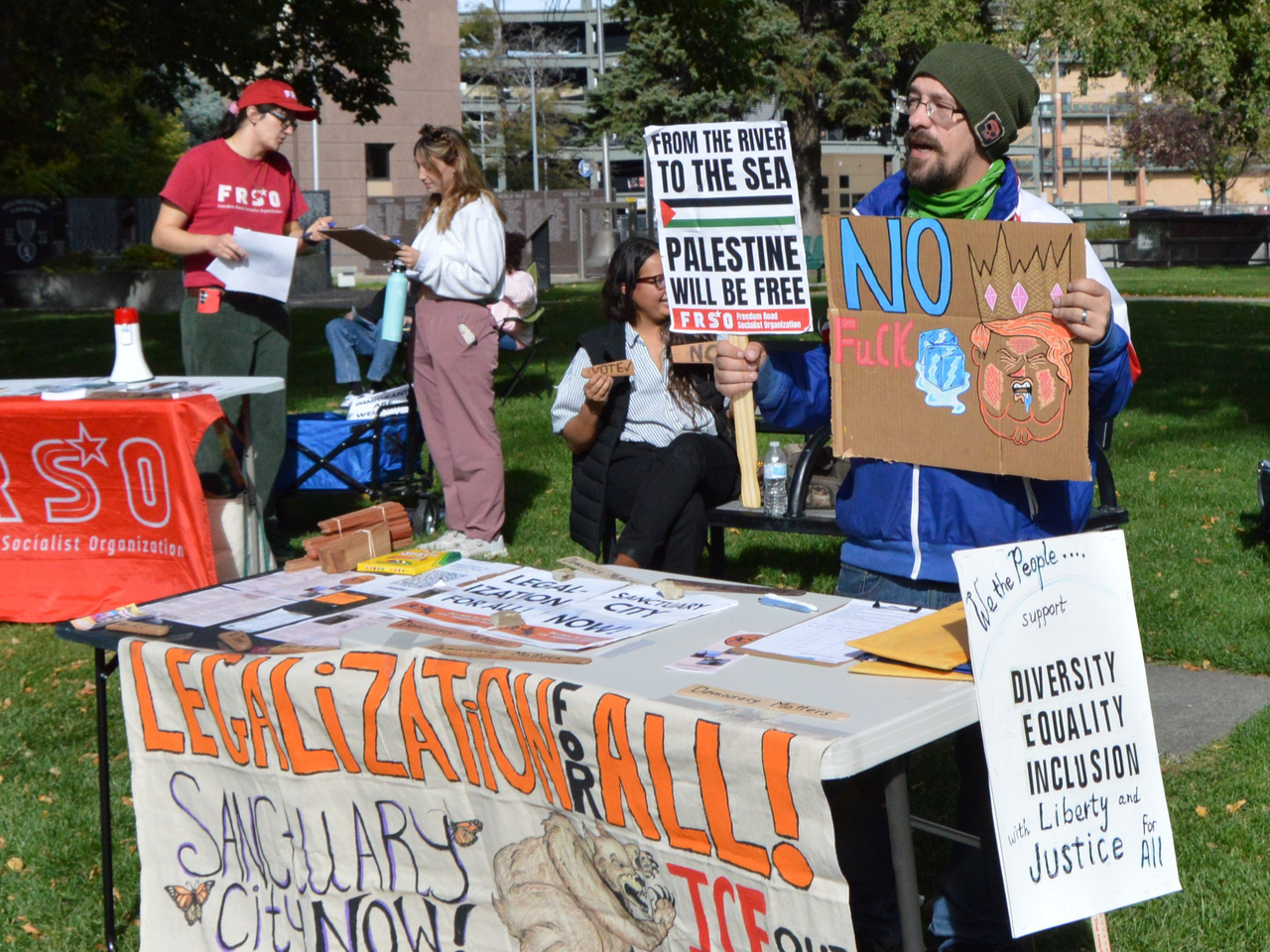 Protesters holding signs.