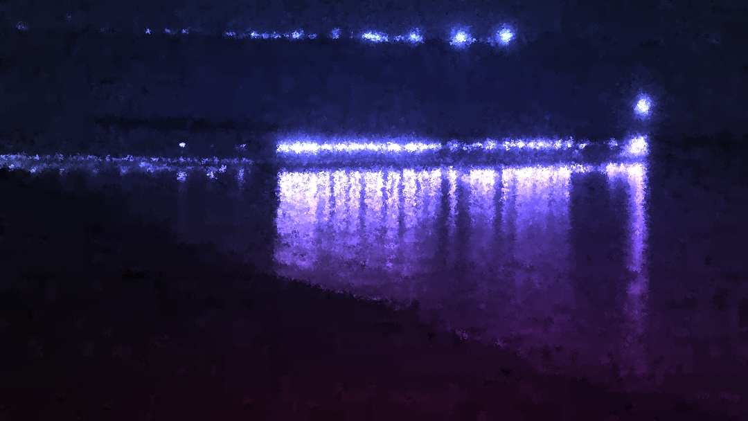 Tinted shoreline with lights.