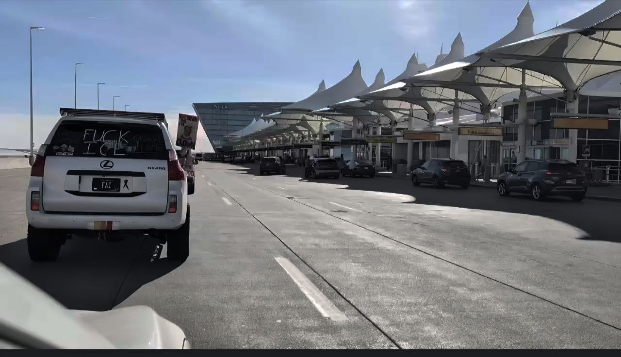 Car caravan against deportation flights at Denver International Airport.