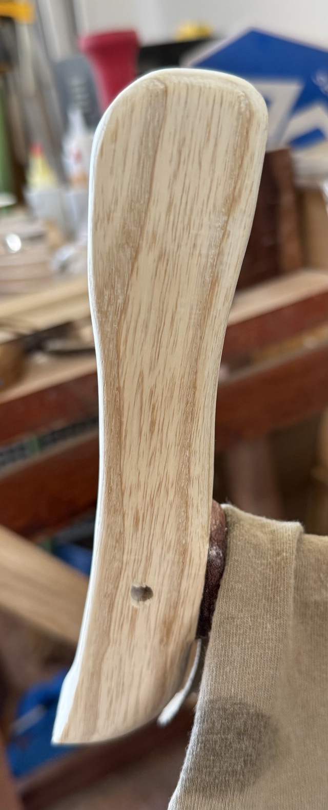 The cane handle, placed on the shaft, with a scrap of T-shirt sitting on the shaft