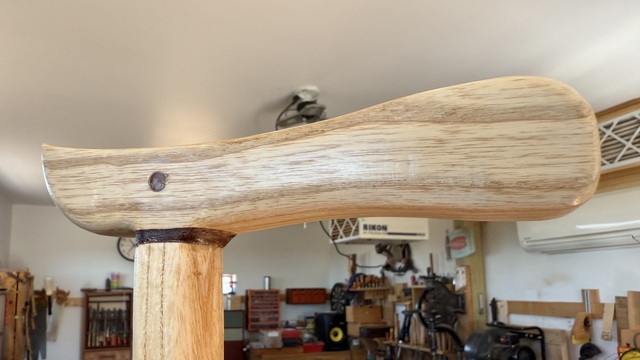 The nearly-finished cane, looking shiny in the light, with no visible gaps and most of the grain filled