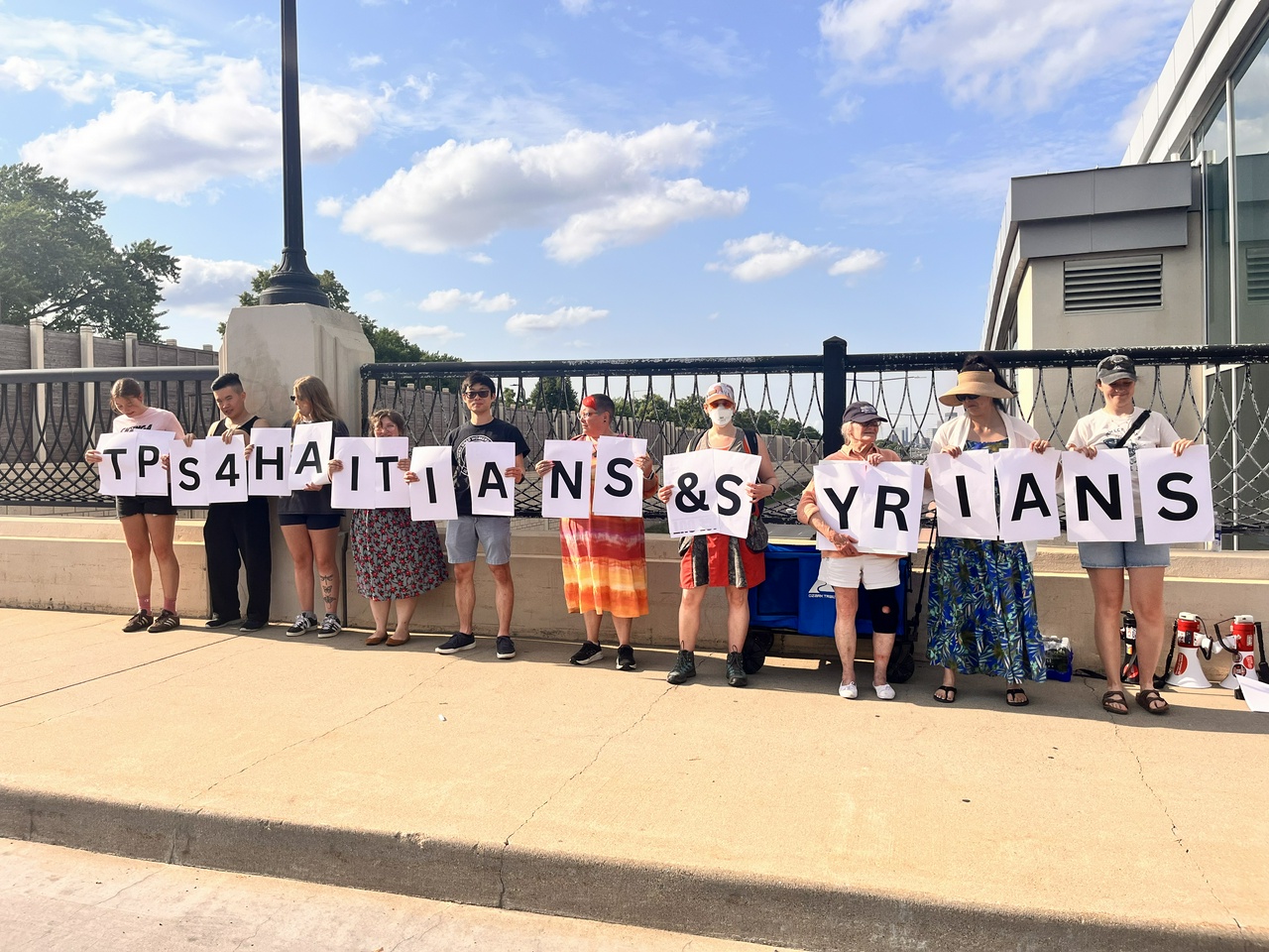 Minneapolis banners against Supreme Court’s attacks on TPS for Haitians and Syrians