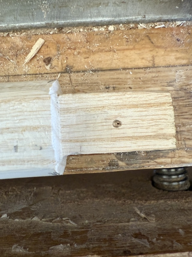 A larger hole, offset by 1mm or so toward the shoulder of the tenon on the cane shaft