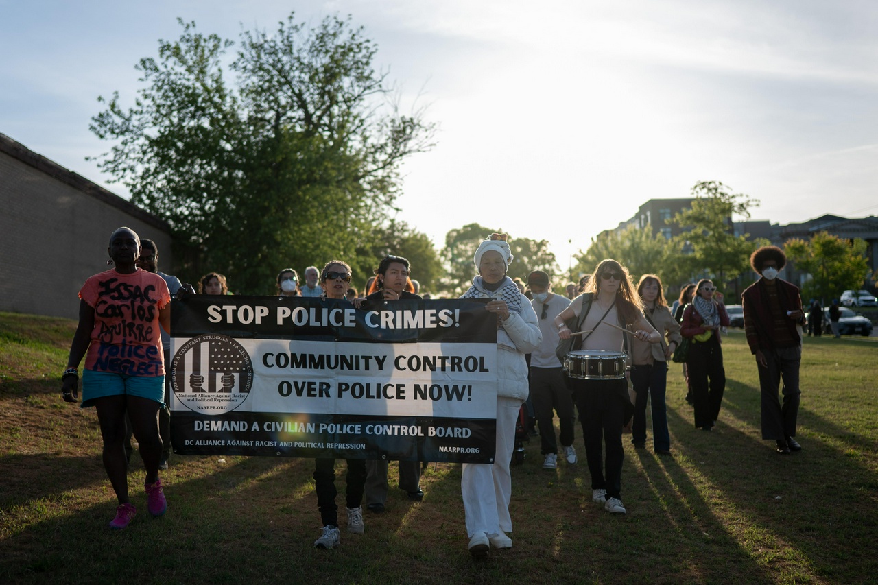 Attendees march in honor of Isaac Aguirre, whose body was found hanging from a tree at the 4th District police station on April 13.