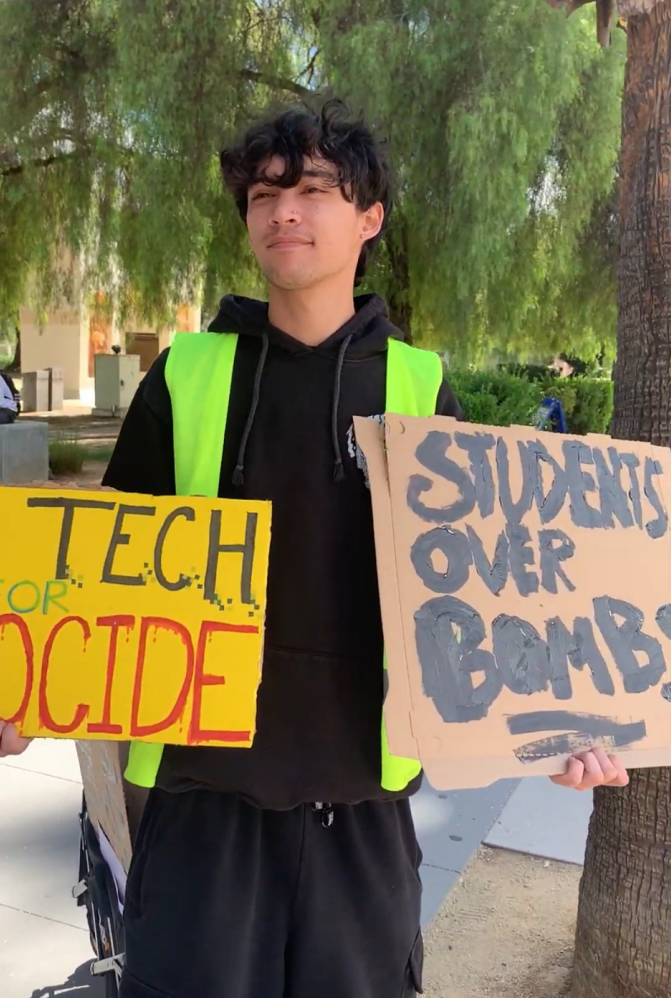 A protester holding signs.