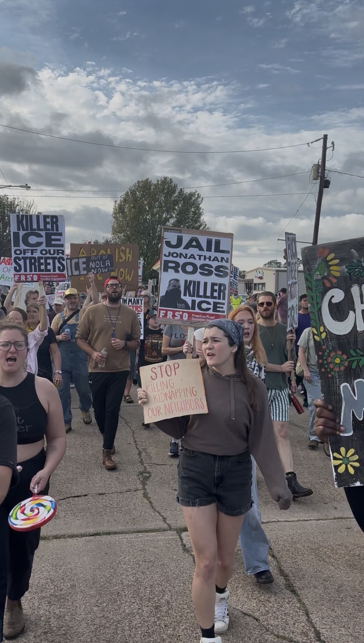 Protestors march down Martinique Avenue, a street targeted by Greg Bovino, to show support for immigrants and demand justice for Renee Good.