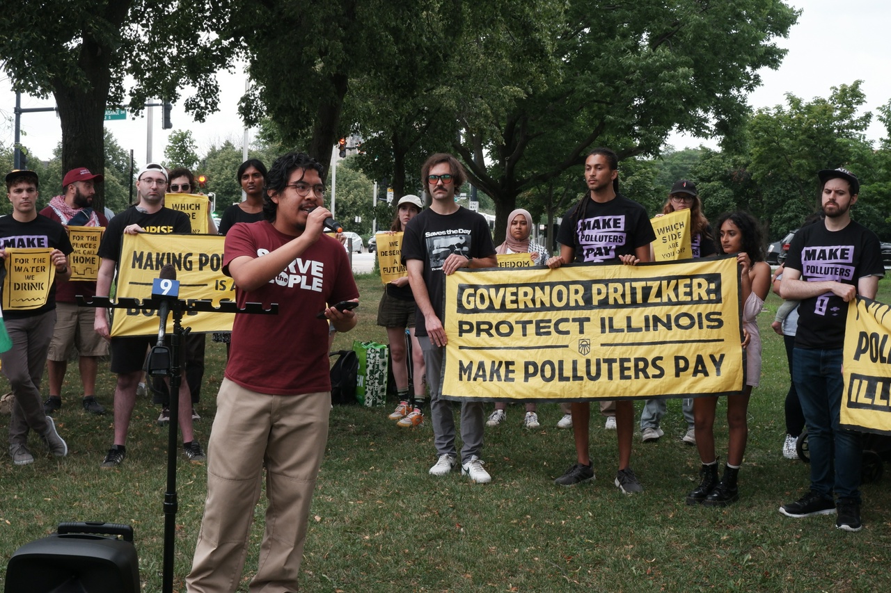 A group of protesters holding banners.