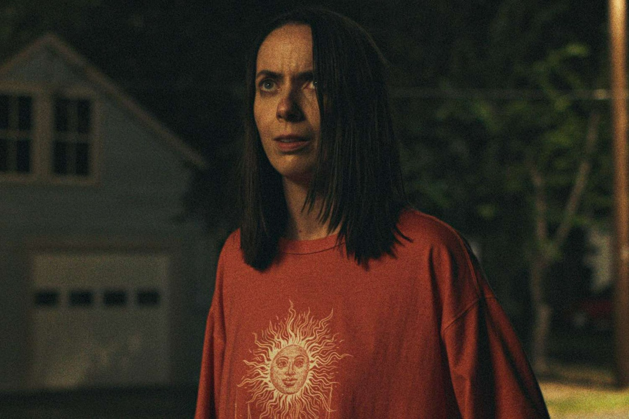 Patricia in the street, watching and waiting for something to happen