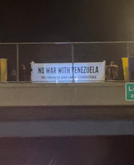 Milwaukee banner drop opposes U.S. attacks on Venezuela.