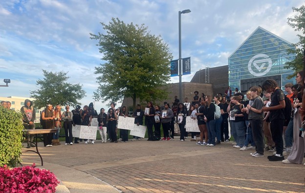 GVSU Students hold a moment of silence for Demartravion Reed at a vigil on campus.